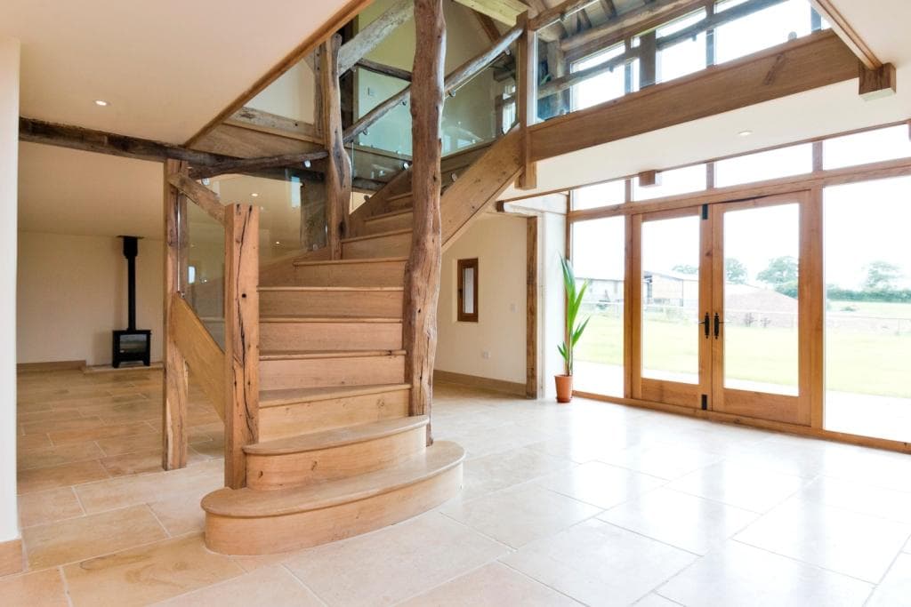 Bespoke oak stair case using a mixtures of new, reclaimed oak and bows